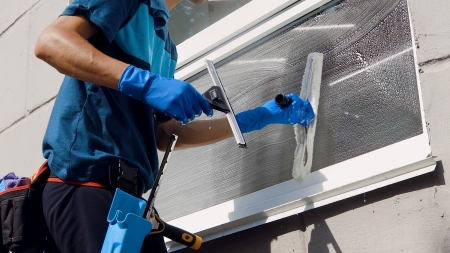 Window cleaner using professional squeegee